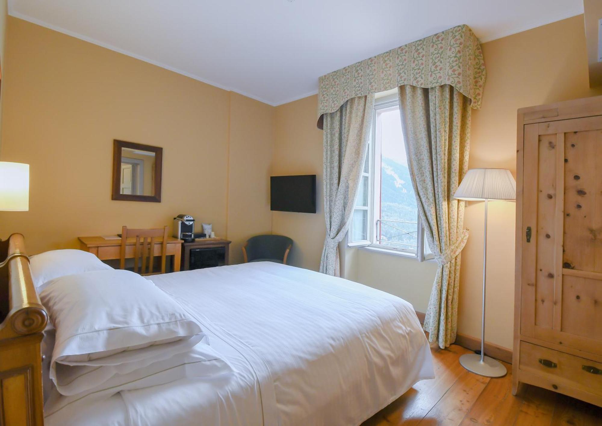 Qc Terme Grand Hotel Bagni Nuovi Bormio Exterior foto A room at the hotel